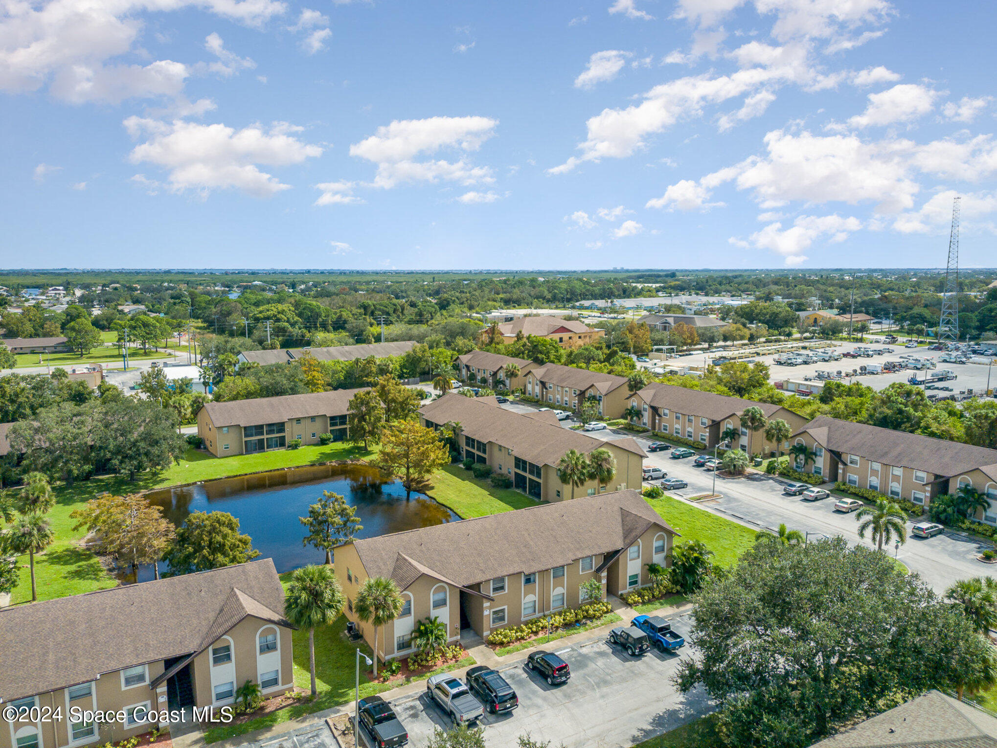 280 Spring Drive, Unit 4 Merritt Island, FL 32953 - Photo 29 of 32 an aerial view of residential houses with outdoor space