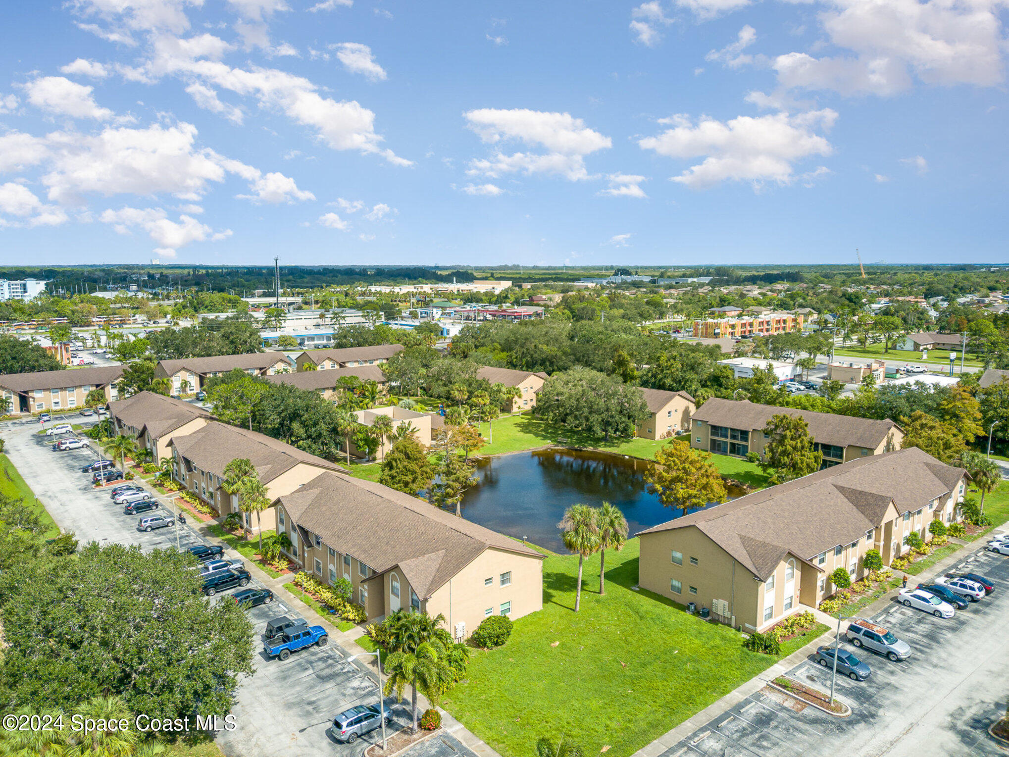 280 Spring Drive, Unit 4 Merritt Island, FL 32953 - Photo 30 of 32 an aerial view of residential houses with outdoor space