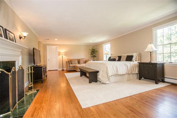 42 Bellevue Road Wellesley, MA 02481 - Photo 7 of 13 a spacious bedroom with a bed a couch and a large window