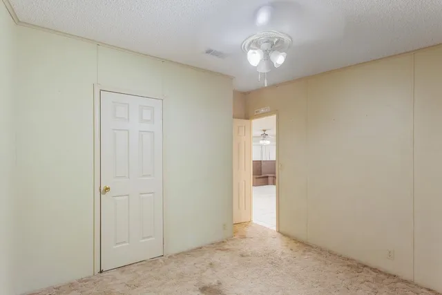 a view of an empty room with a large window