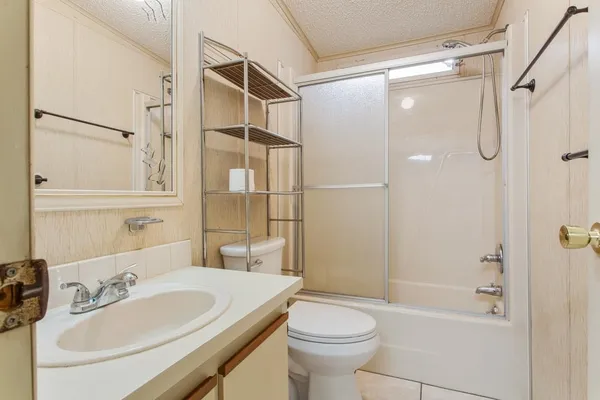 a view of a house with backyard and porch