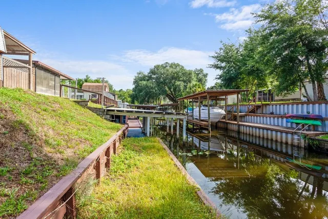 an aerial view of a house with a lake view