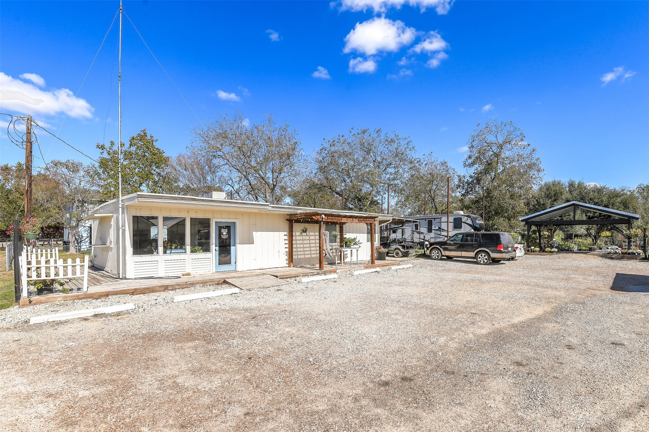 511 West Main Street Weimar, TX 78962 - Photo 12 of 30 a front view of a house with a yard and outdoor space