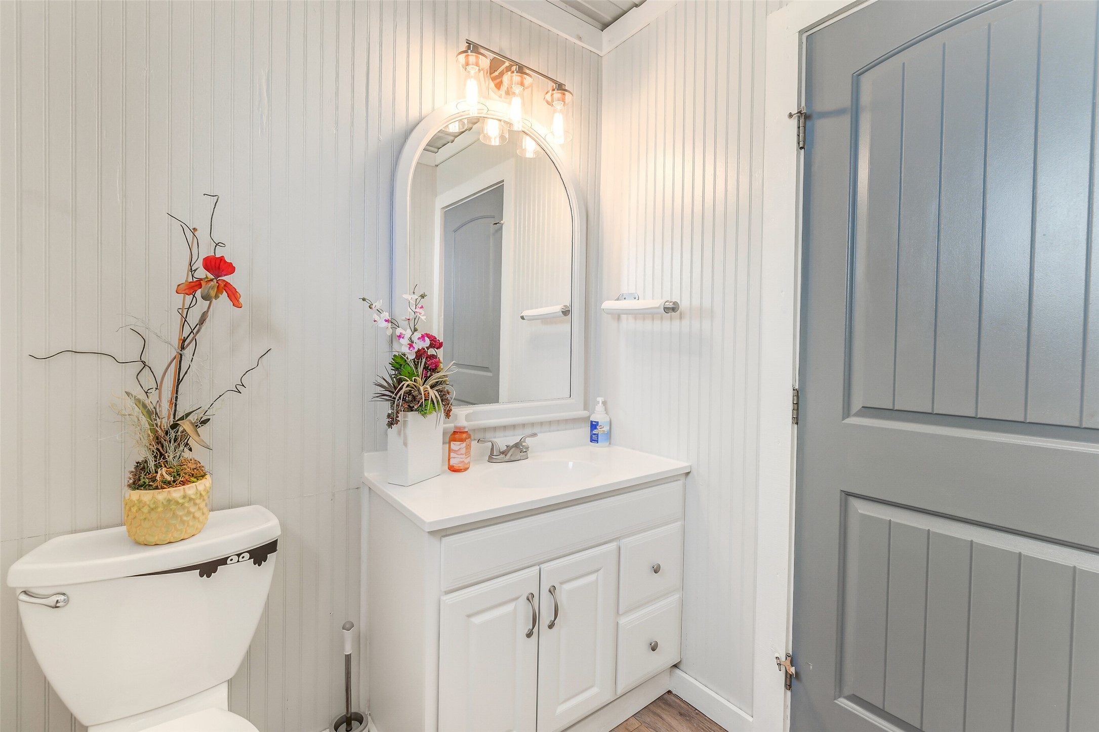 511 West Main Street Weimar, TX 78962 - Photo 9 of 30 a bathroom with a sink mirror vanity and toilet