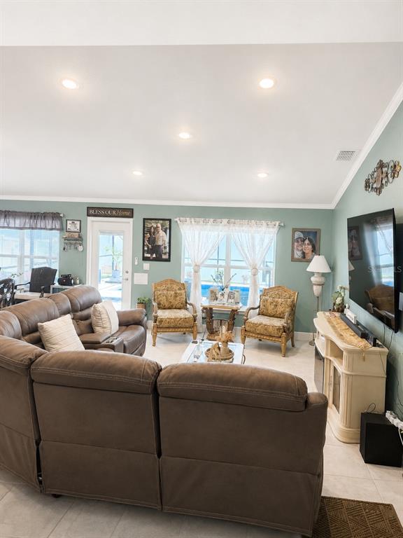 5892 Southwest 82nd Lane Ocala, FL 34476 - Photo 6 of 24 a living room with furniture and a flat screen tv