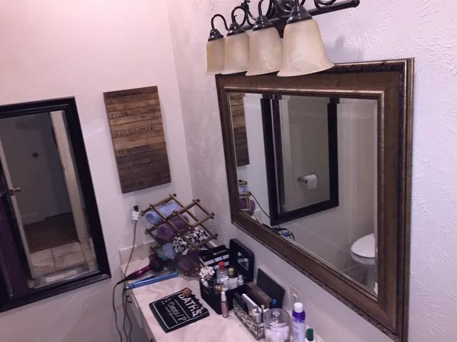 a kitchen with a sink a stove and a shower