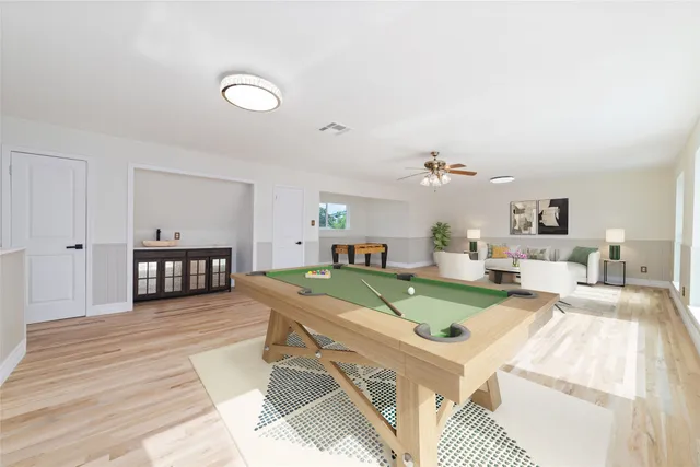 a view of a livingroom with furniture nad wooden floor