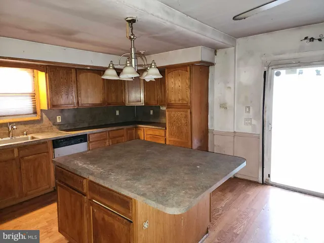 a view of room with window and hardwood floor