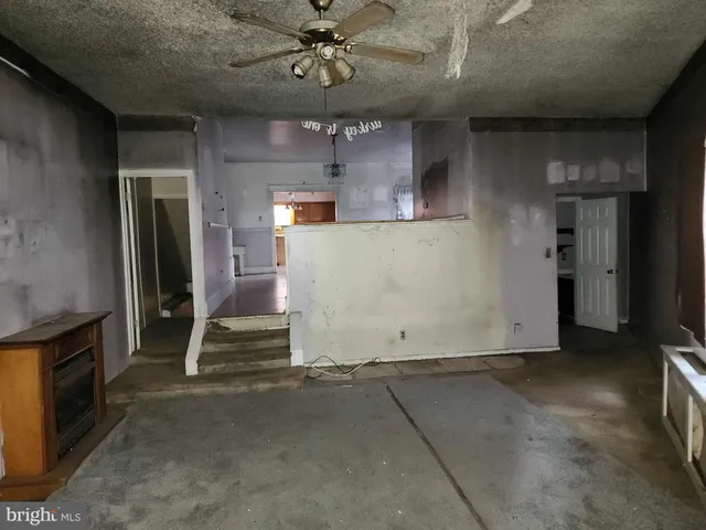 an empty room with a fireplace