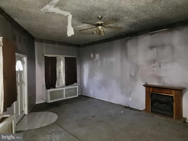 an empty room with a fireplace