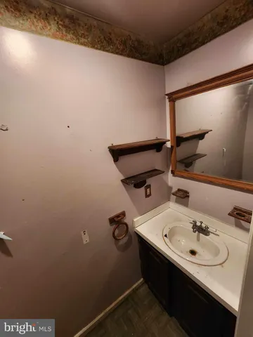 a view of a room with wooden walls