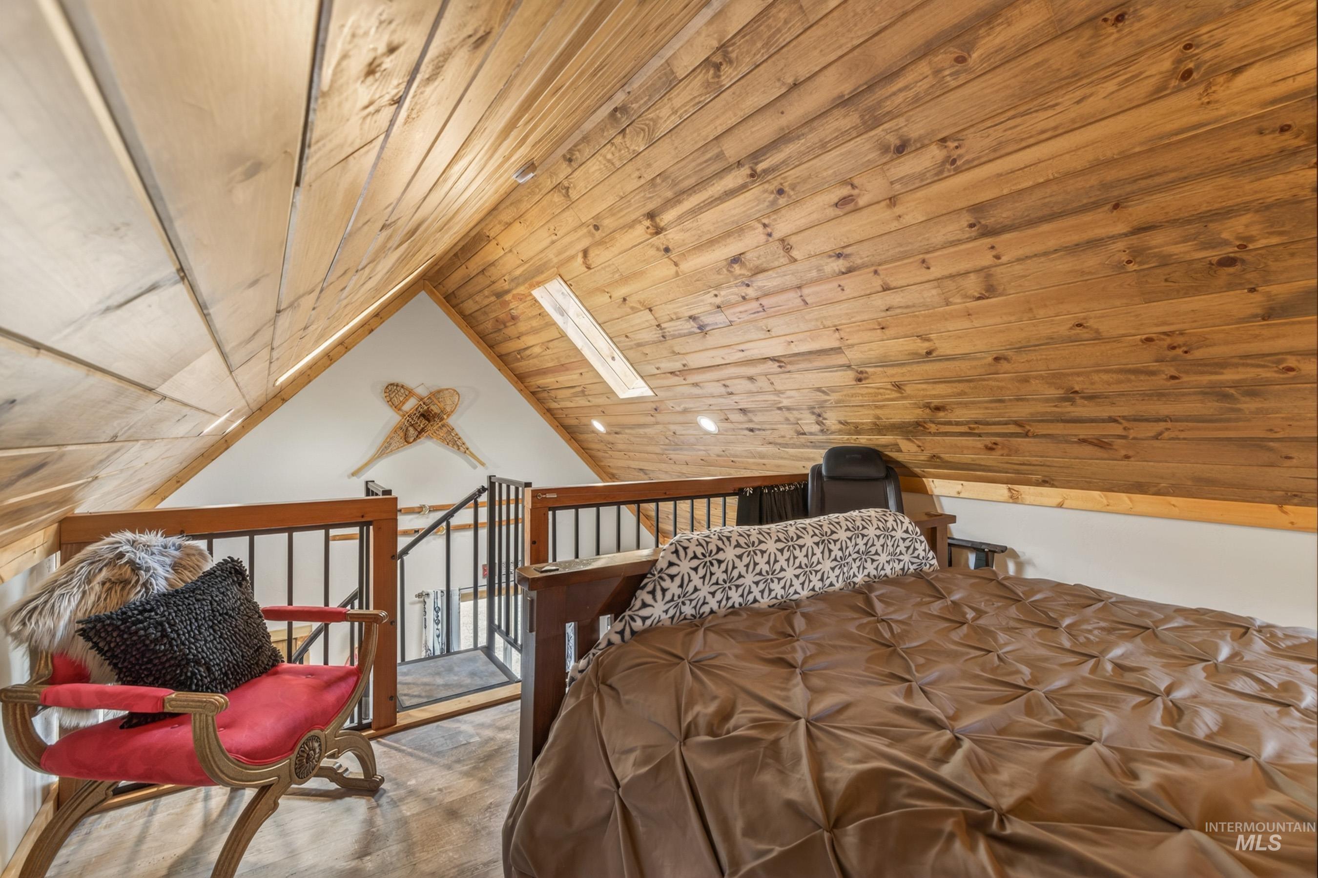 1432 Salmon Drive Riggins, ID 83549 - Photo 23 of 39 Vaulted wood-plank ceiling with skylight and recessed lighting