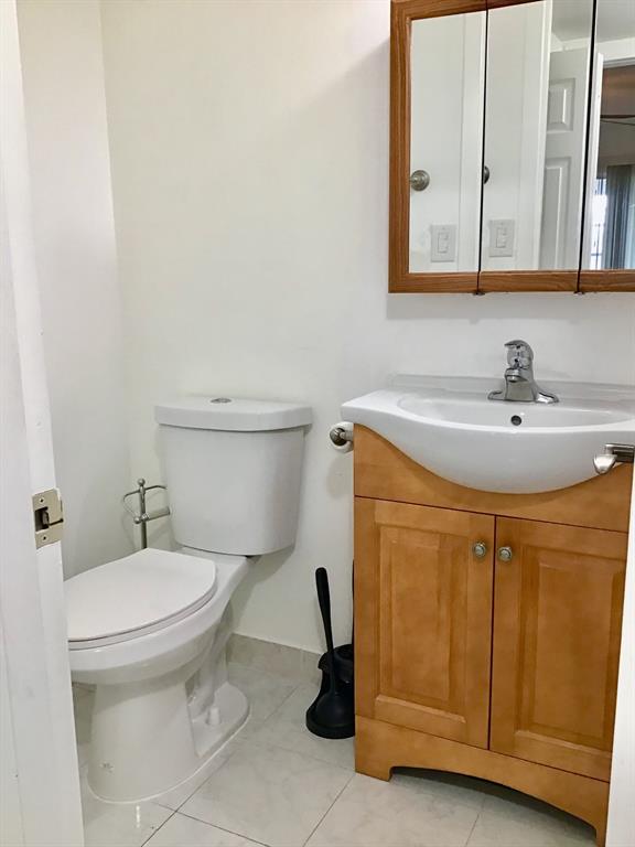 2038 Exeter C, Unit 2038 Boca Raton, FL 33434 - Photo 16 of 37 a bathroom with a sink and a toilet