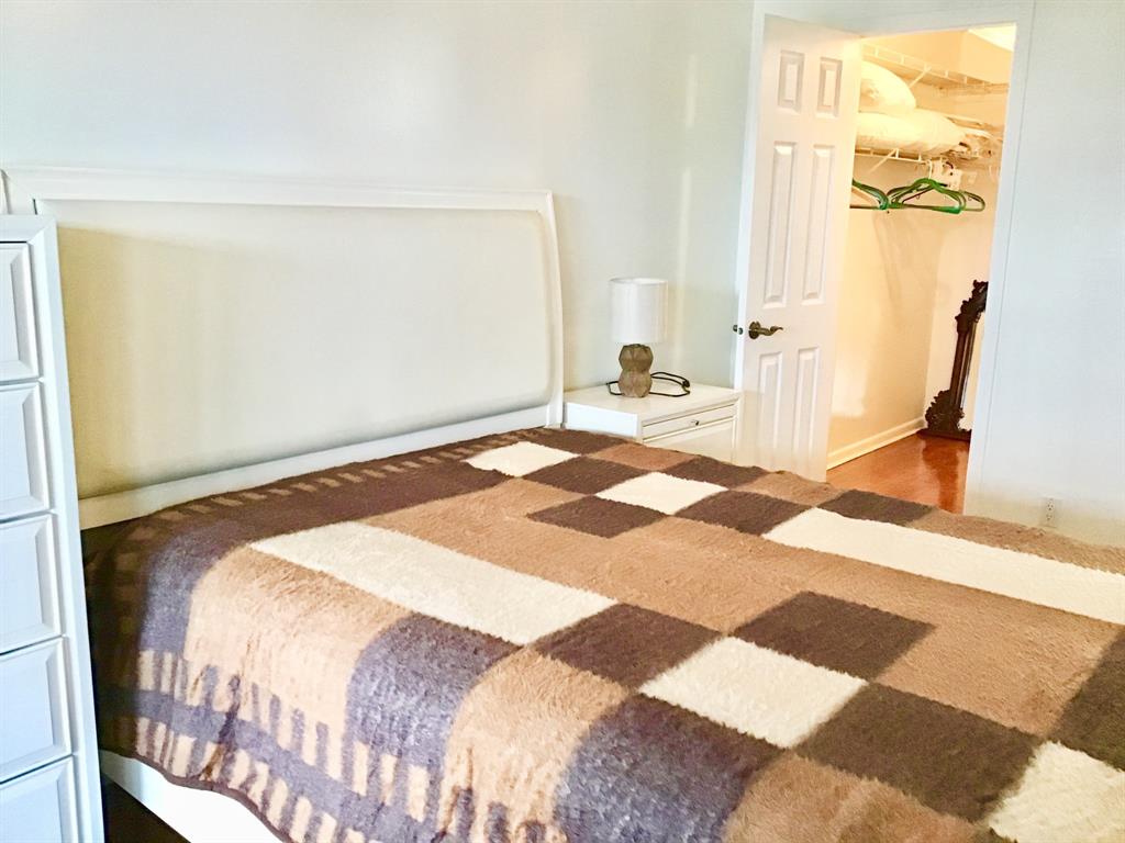 2038 Exeter C, Unit 2038 Boca Raton, FL 33434 - Photo 18 of 37 a bedroom with a bed and a window