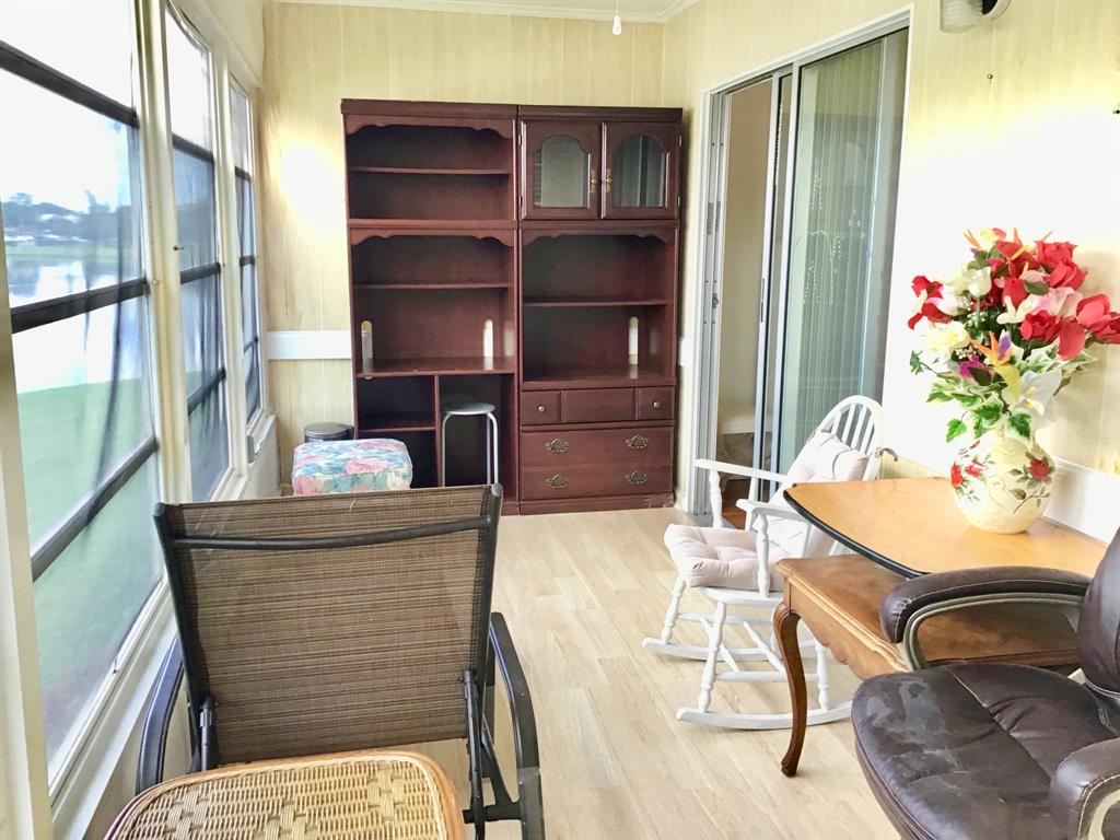 2038 Exeter C, Unit 2038 Boca Raton, FL 33434 - Photo 29 of 37 a living room with furniture