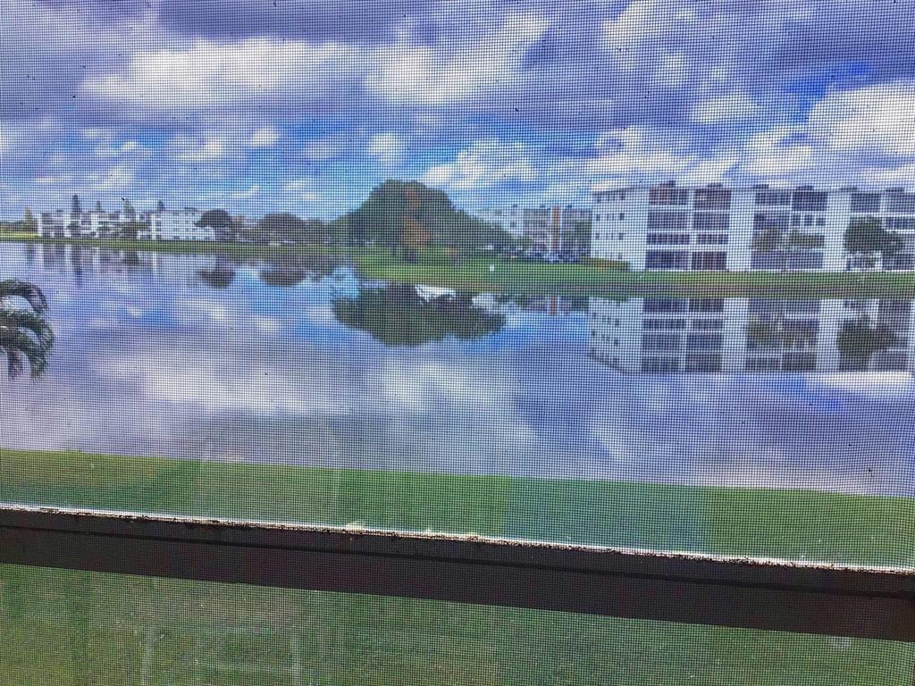 2038 Exeter C, Unit 2038 Boca Raton, FL 33434 - Photo 32 of 37 a view of a lake