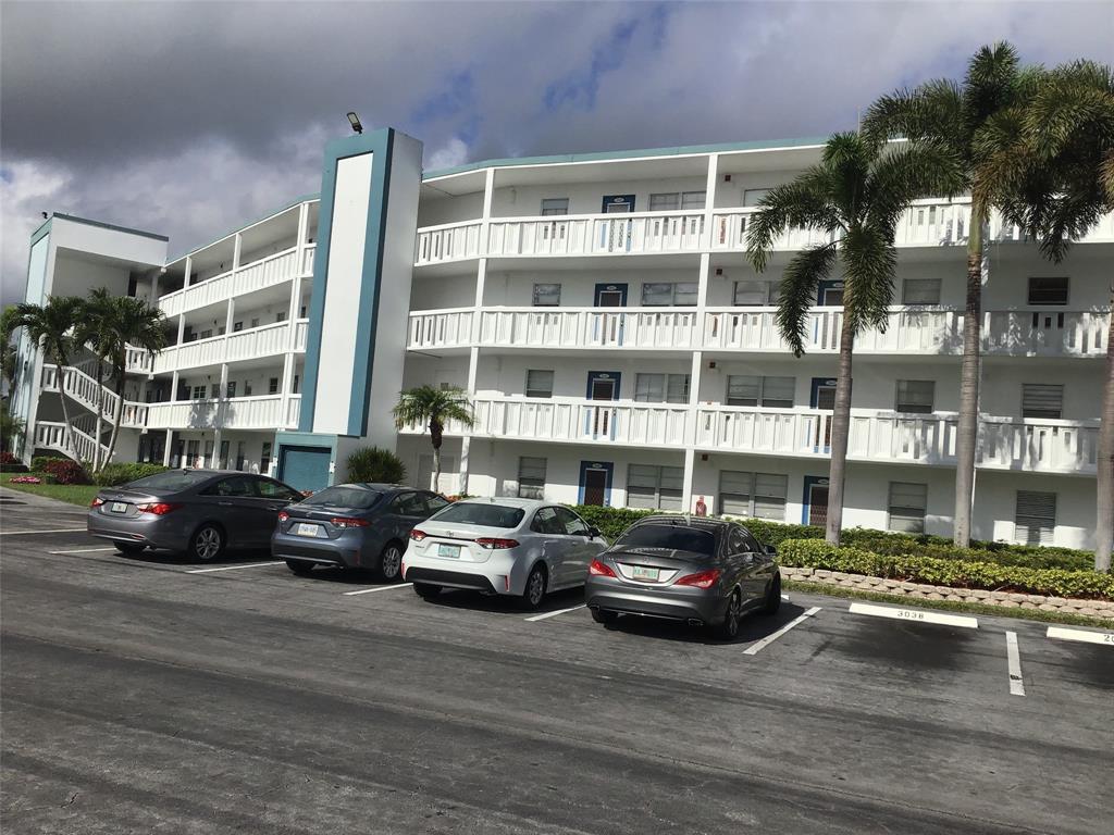 2038 Exeter C, Unit 2038 Boca Raton, FL 33434 - Photo 33 of 37 a car parked in front of a building
