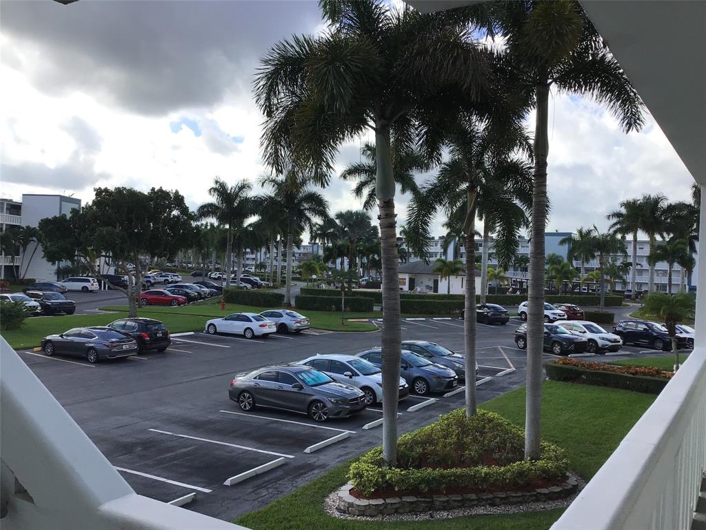2038 Exeter C, Unit 2038 Boca Raton, FL 33434 - Photo 37 of 37 a view of a garden with cars