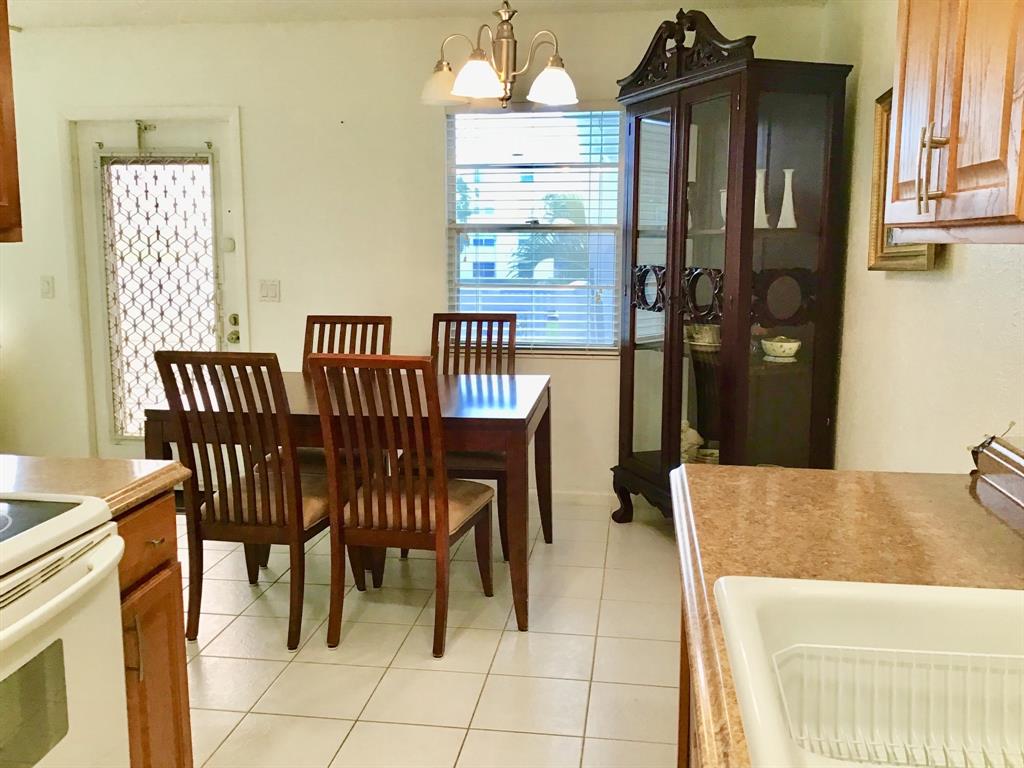 2038 Exeter C, Unit 2038 Boca Raton, FL 33434 - Photo 7 of 37 a view of a dining room with furniture