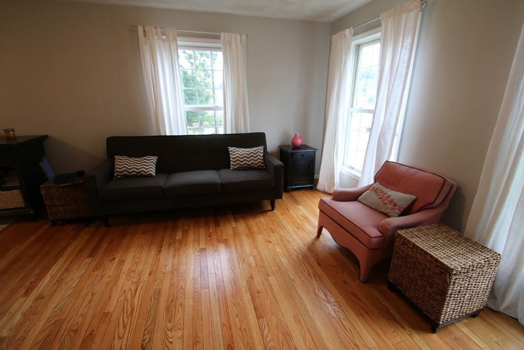 301 Ridge Road, Unit A Revere, MA 02151 - Photo 5 of 27 a living room with furniture and a window