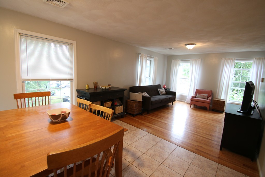 301 Ridge Road, Unit A Revere, MA 02151 - Photo 9 of 27 a living room with furniture window and wooden floor