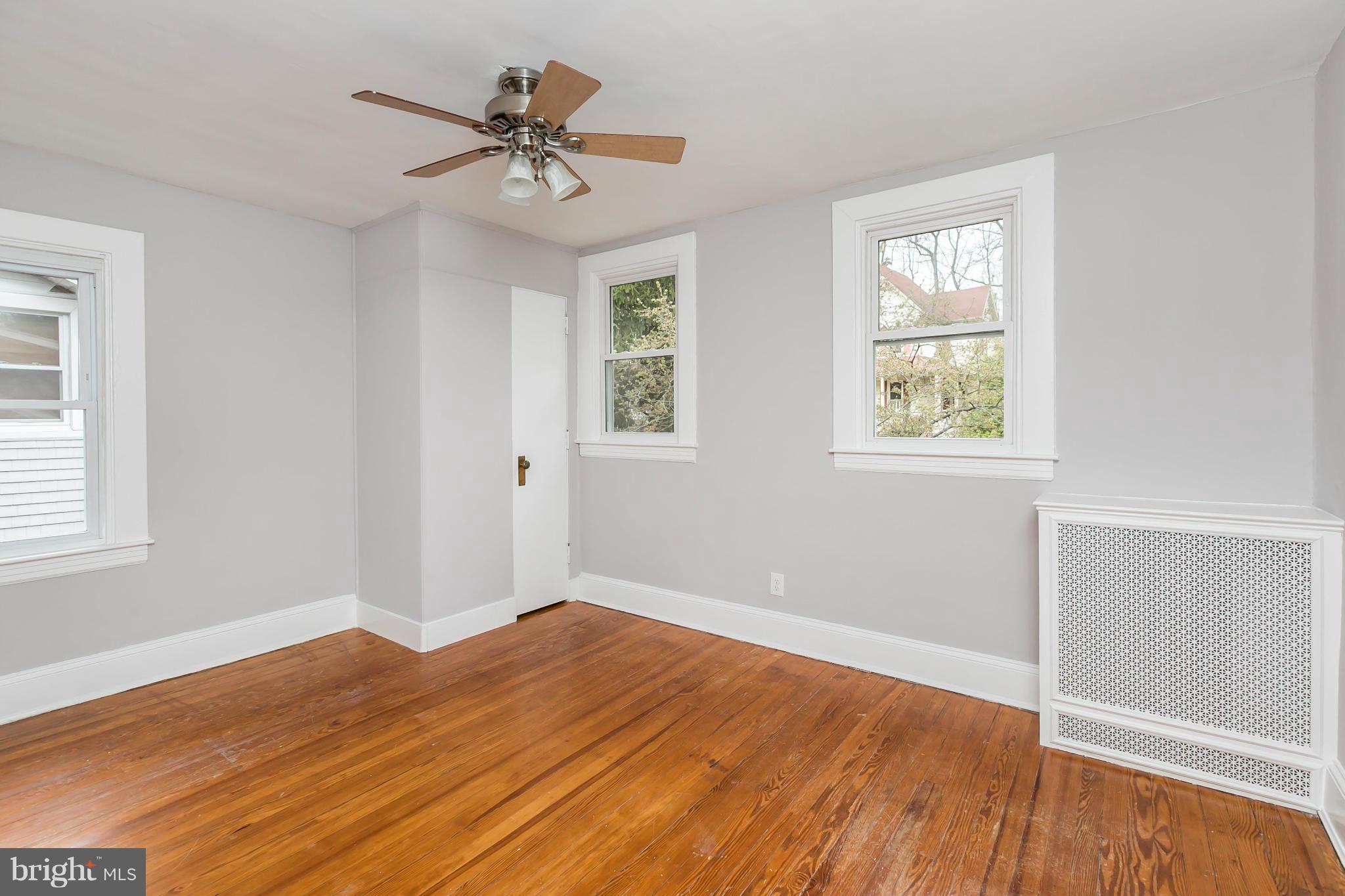 621 Deepdene Road Baltimore, MD 21210 - Photo 14 of 27 a view of a room with wooden floor and a window