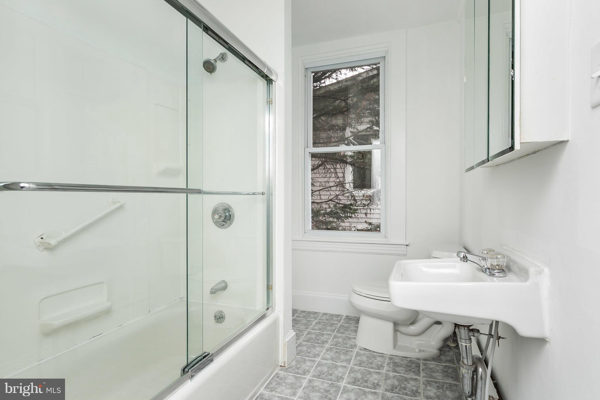 621 Deepdene Road Baltimore, MD 21210 - Photo 16 of 27 a bathroom with a sink toilet and shower