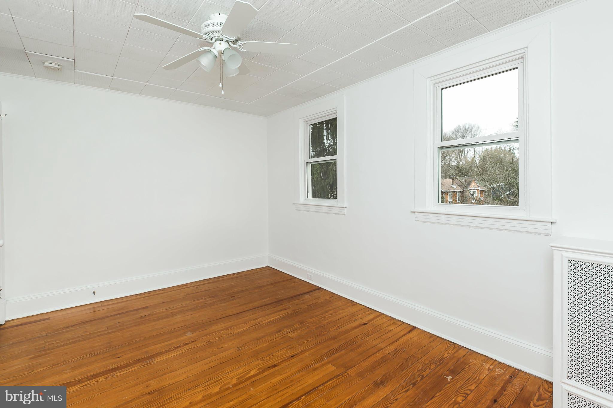 621 Deepdene Road Baltimore, MD 21210 - Photo 20 of 27 an empty room with a window and wooden floor