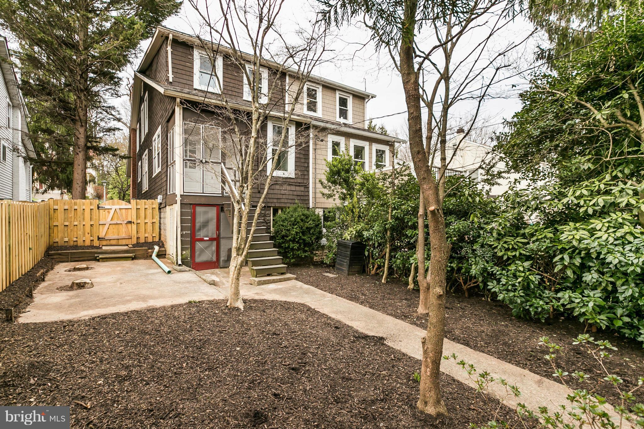 621 Deepdene Road Baltimore, MD 21210 - Photo 27 of 27 a view of a street with potted plants and large trees
