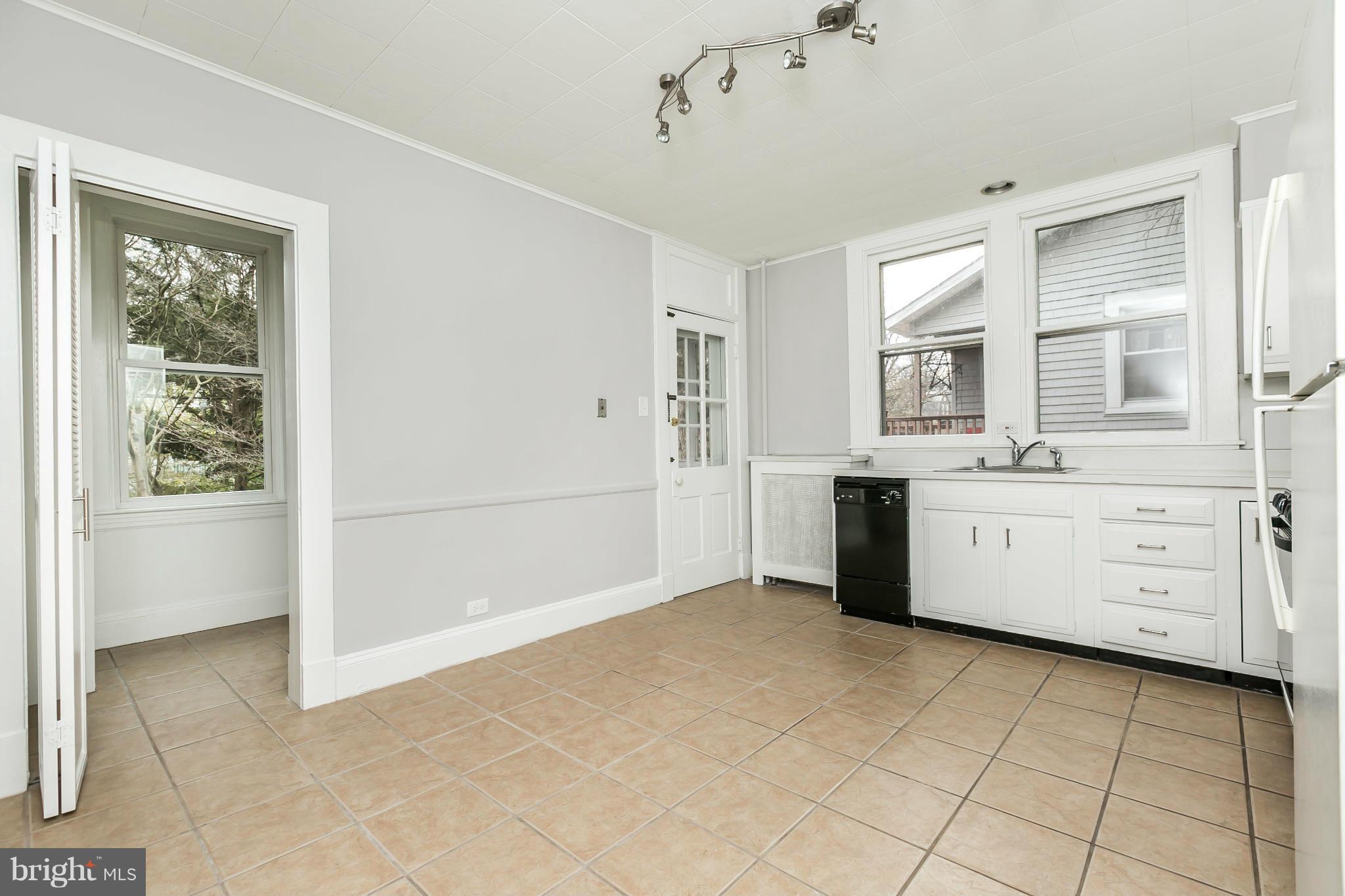 621 Deepdene Road Baltimore, MD 21210 - Photo 9 of 27 a view of a kitchen with white cabinets and window