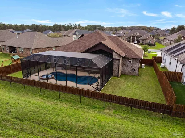 a view of a swimming pool with a couches in a patio