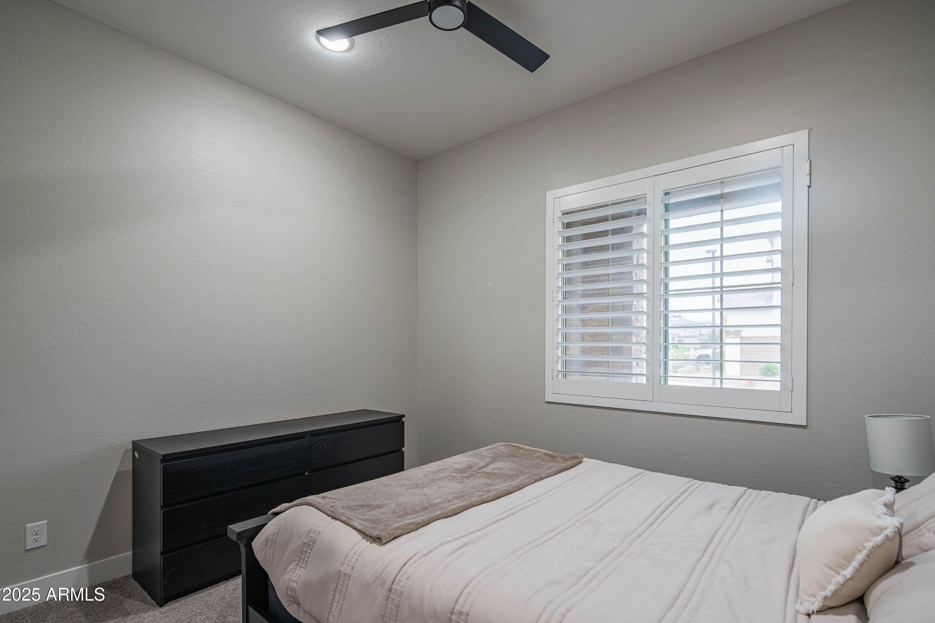 5232 South Cobblestone Street Gilbert, AZ 85298 - Photo 27 of 71 a bedroom with a bed and a window