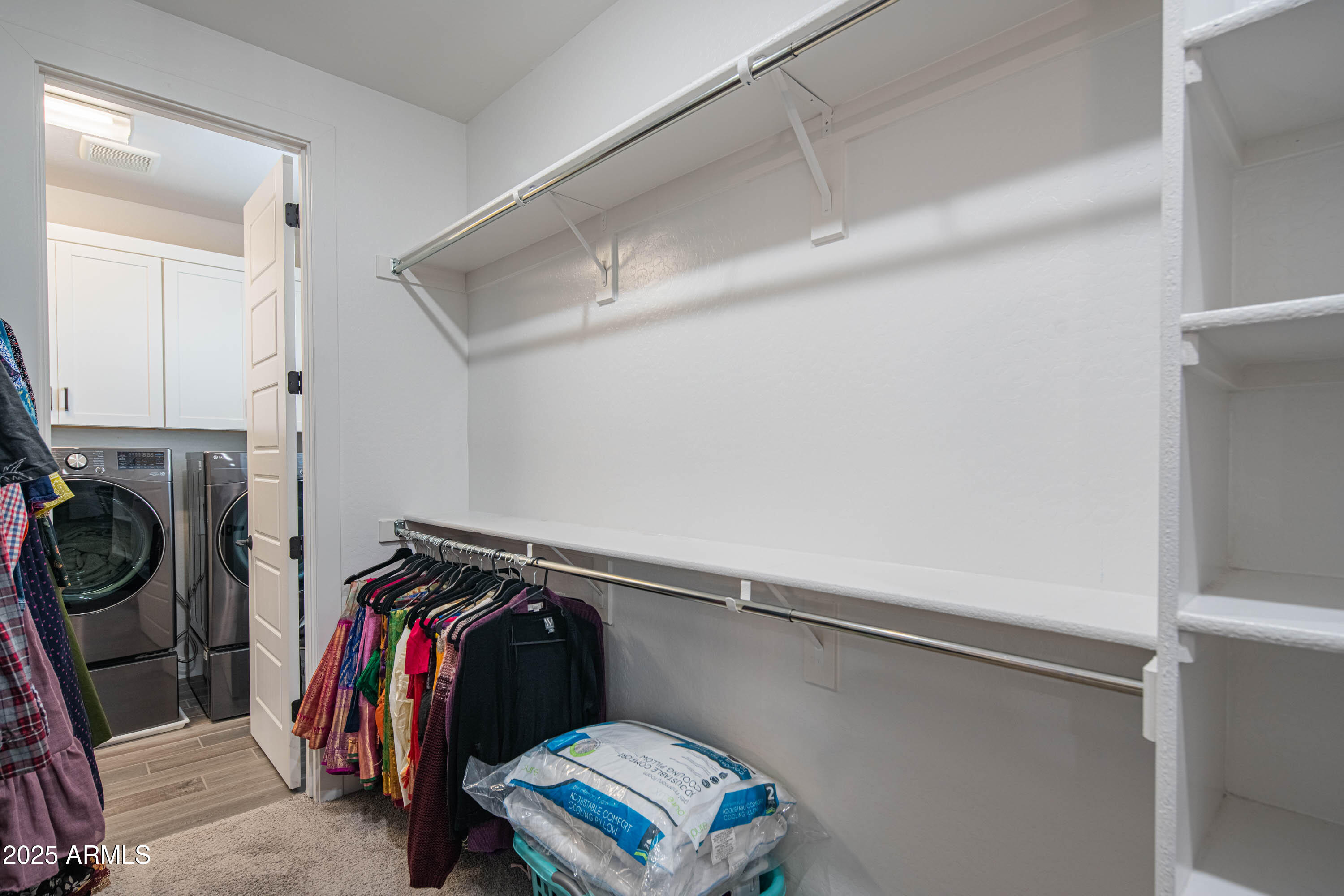 5232 South Cobblestone Street Gilbert, AZ 85298 - Photo 38 of 71 a view of walk in closet with clothes and shoes