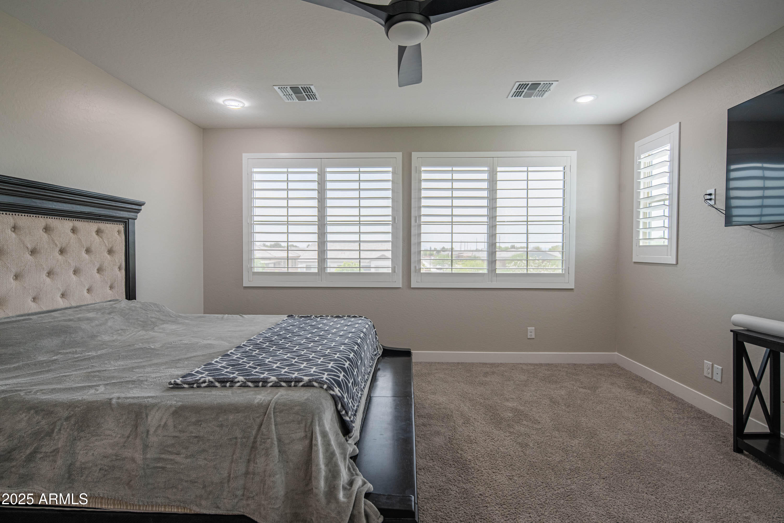 5232 South Cobblestone Street Gilbert, AZ 85298 - Photo 40 of 71 a bedroom with a bed and a window
