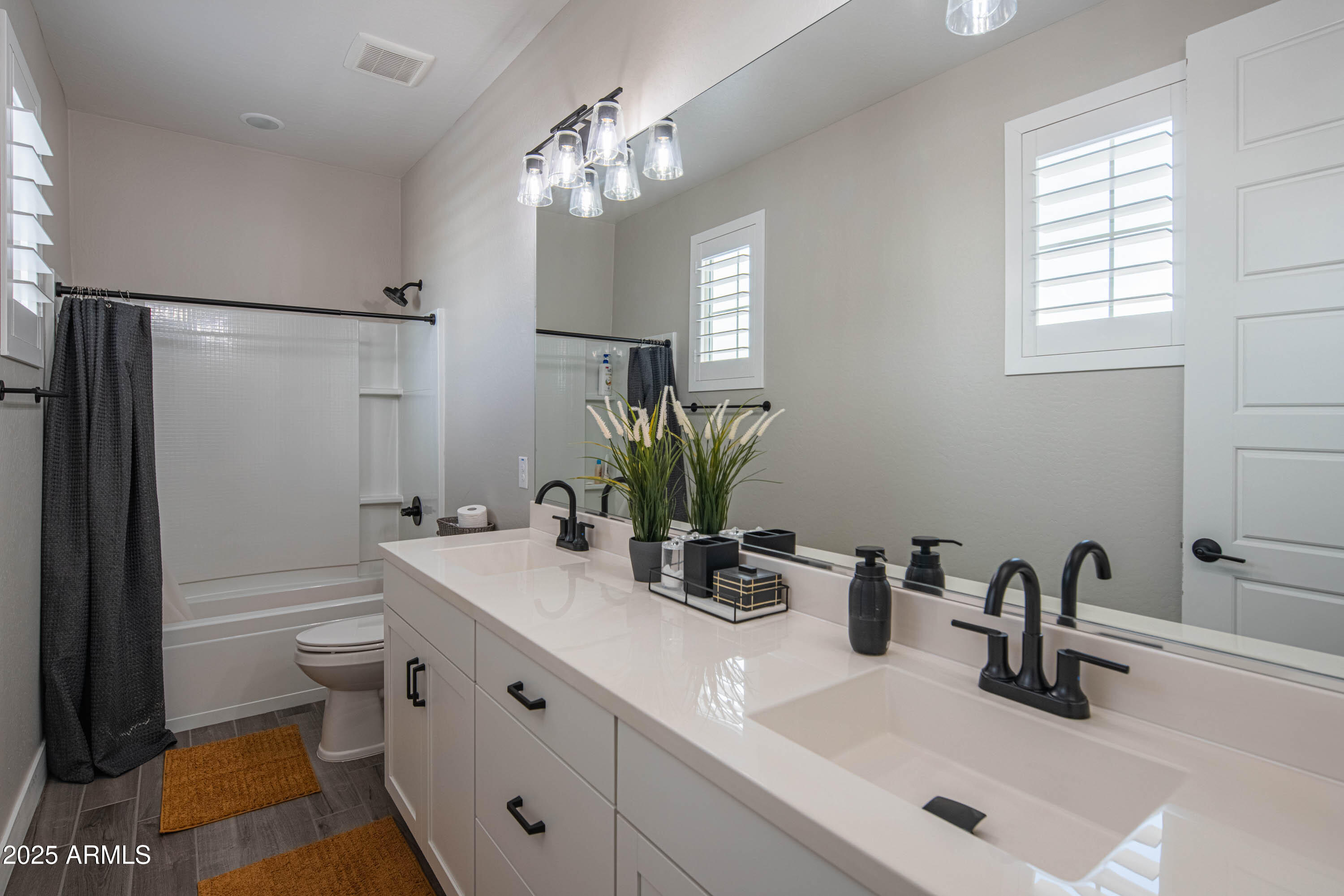 5232 South Cobblestone Street Gilbert, AZ 85298 - Photo 43 of 71 a bathroom with a sink a toilet and shower