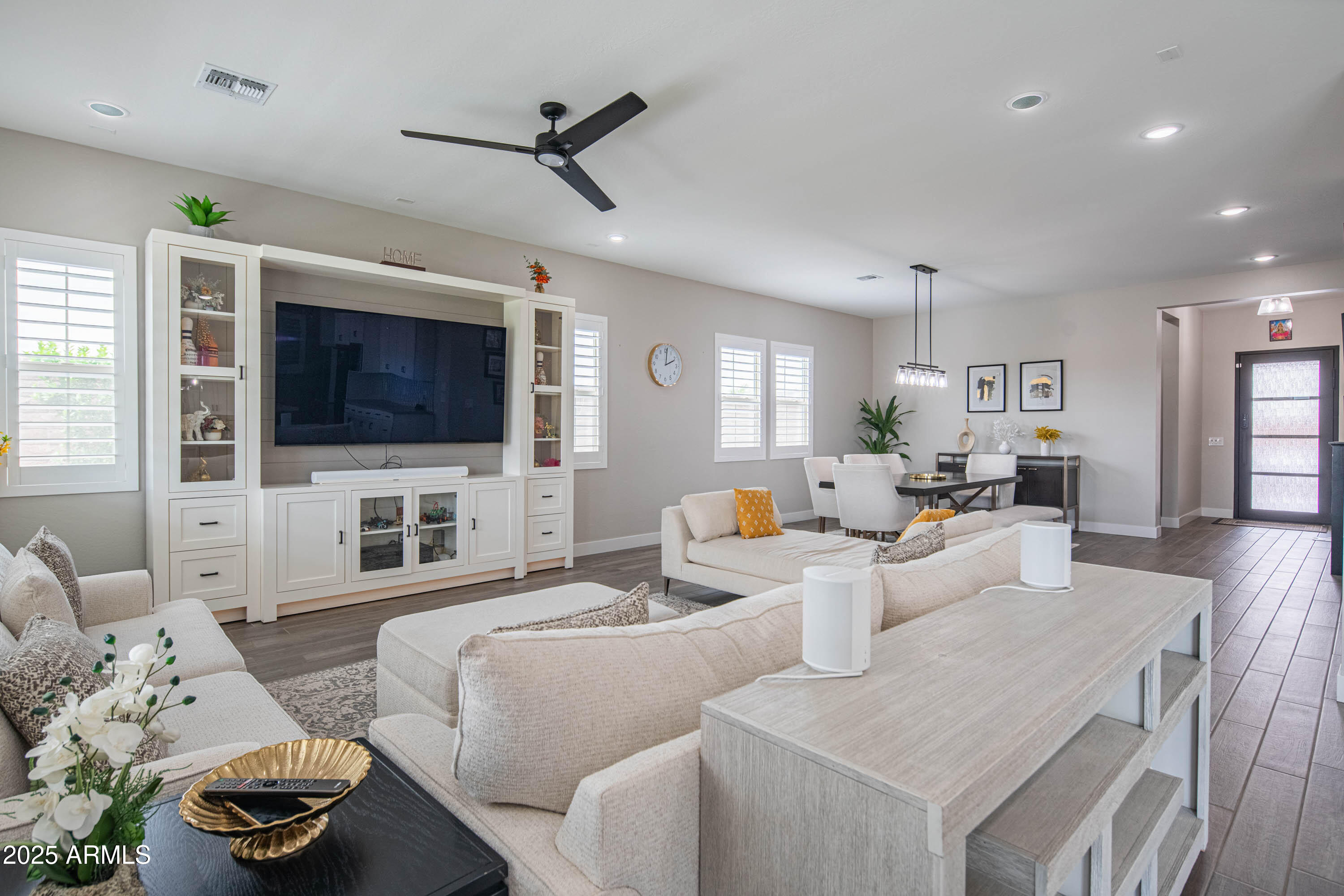 5232 South Cobblestone Street Gilbert, AZ 85298 - Photo 5 of 71 a living room with furniture and a flat screen tv