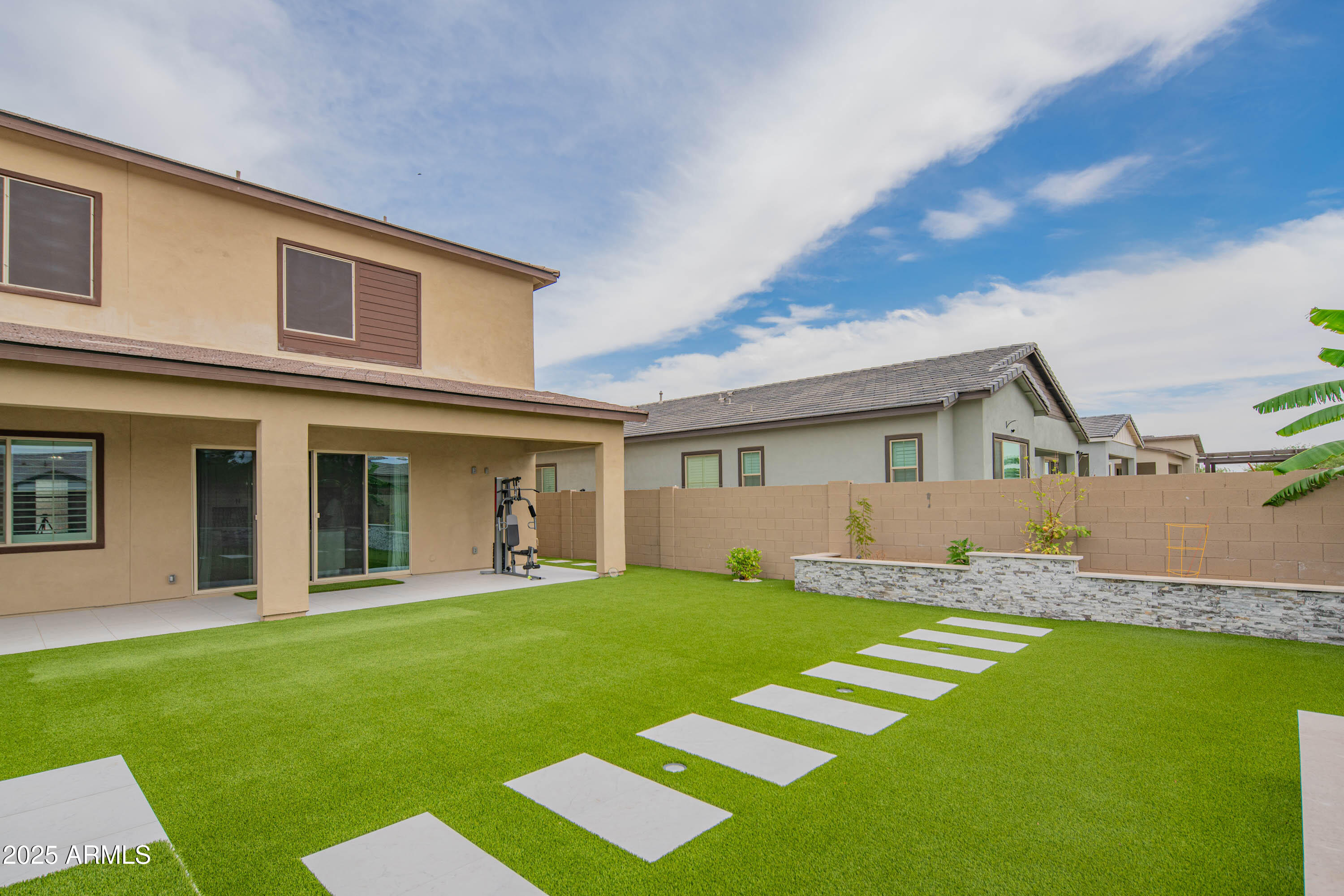 5232 South Cobblestone Street Gilbert, AZ 85298 - Photo 58 of 71 a front view of a house with a yard and porch