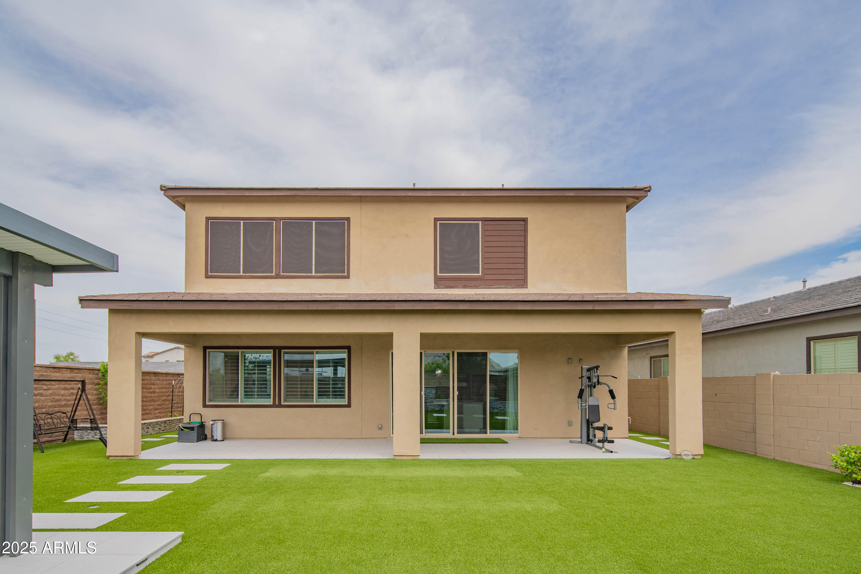 5232 South Cobblestone Street Gilbert, AZ 85298 - Photo 60 of 71 a front view of a house with a yard