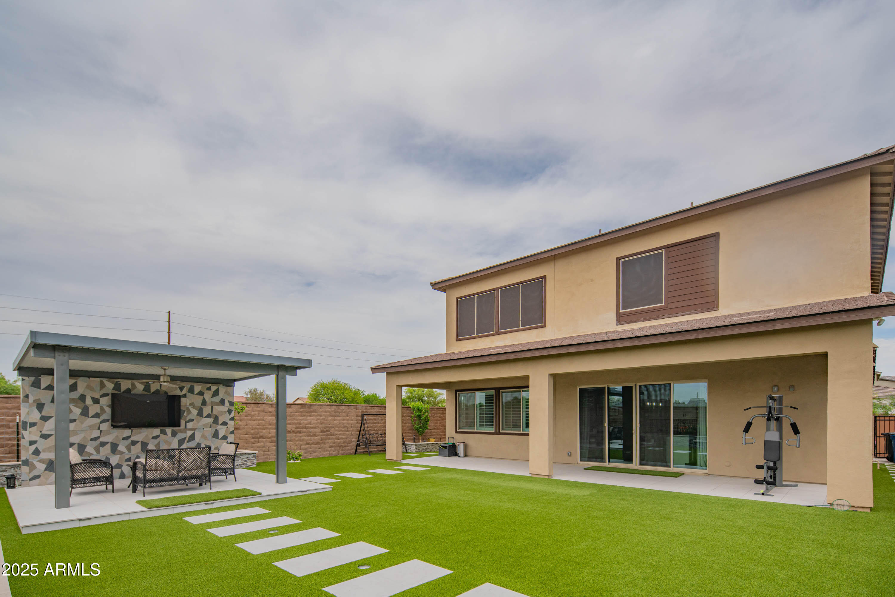 5232 South Cobblestone Street Gilbert, AZ 85298 - Photo 61 of 71 a view of a house with a backyard porch and sitting area