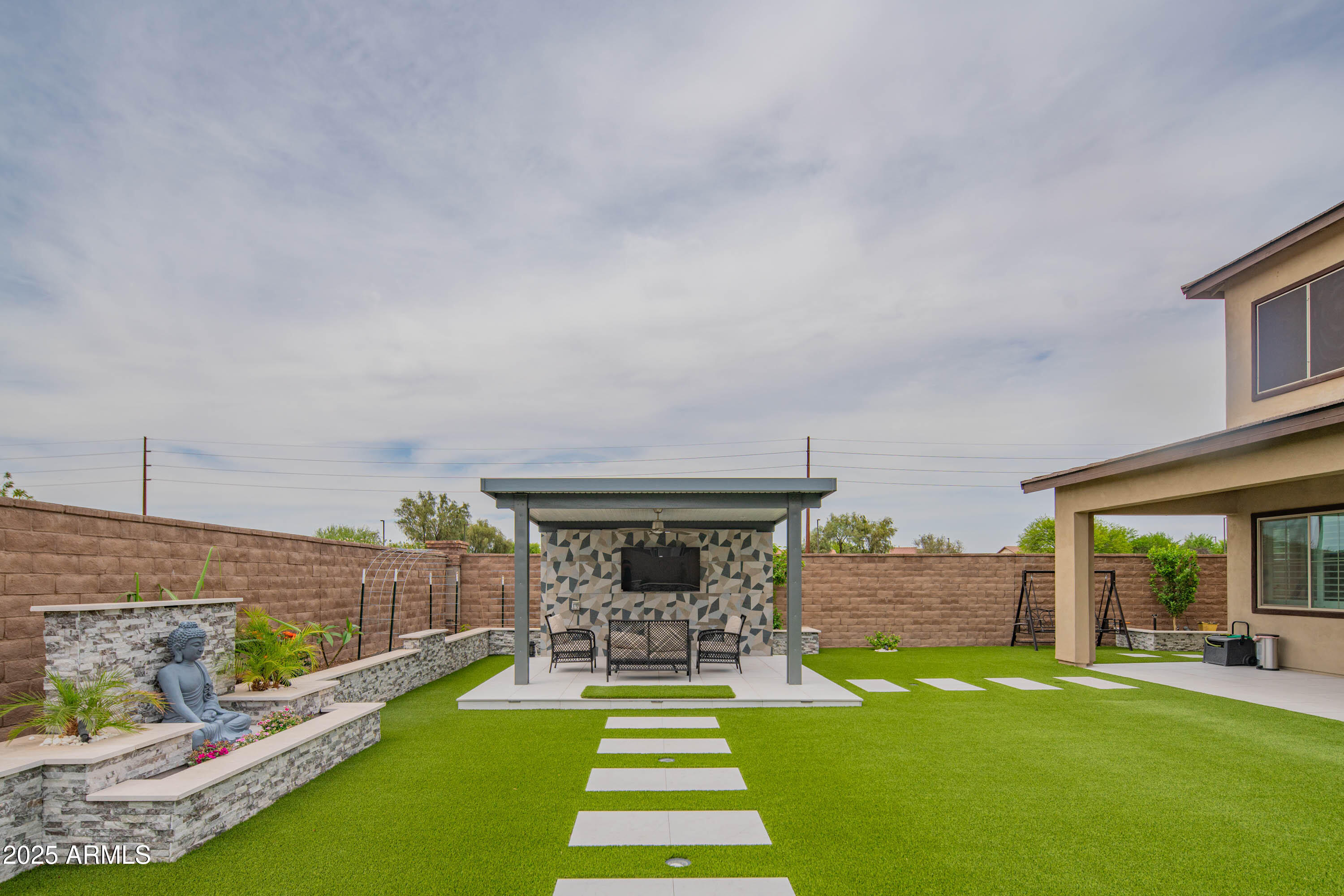 5232 South Cobblestone Street Gilbert, AZ 85298 - Photo 62 of 71 a view of house with backyard porch and outdoor seating