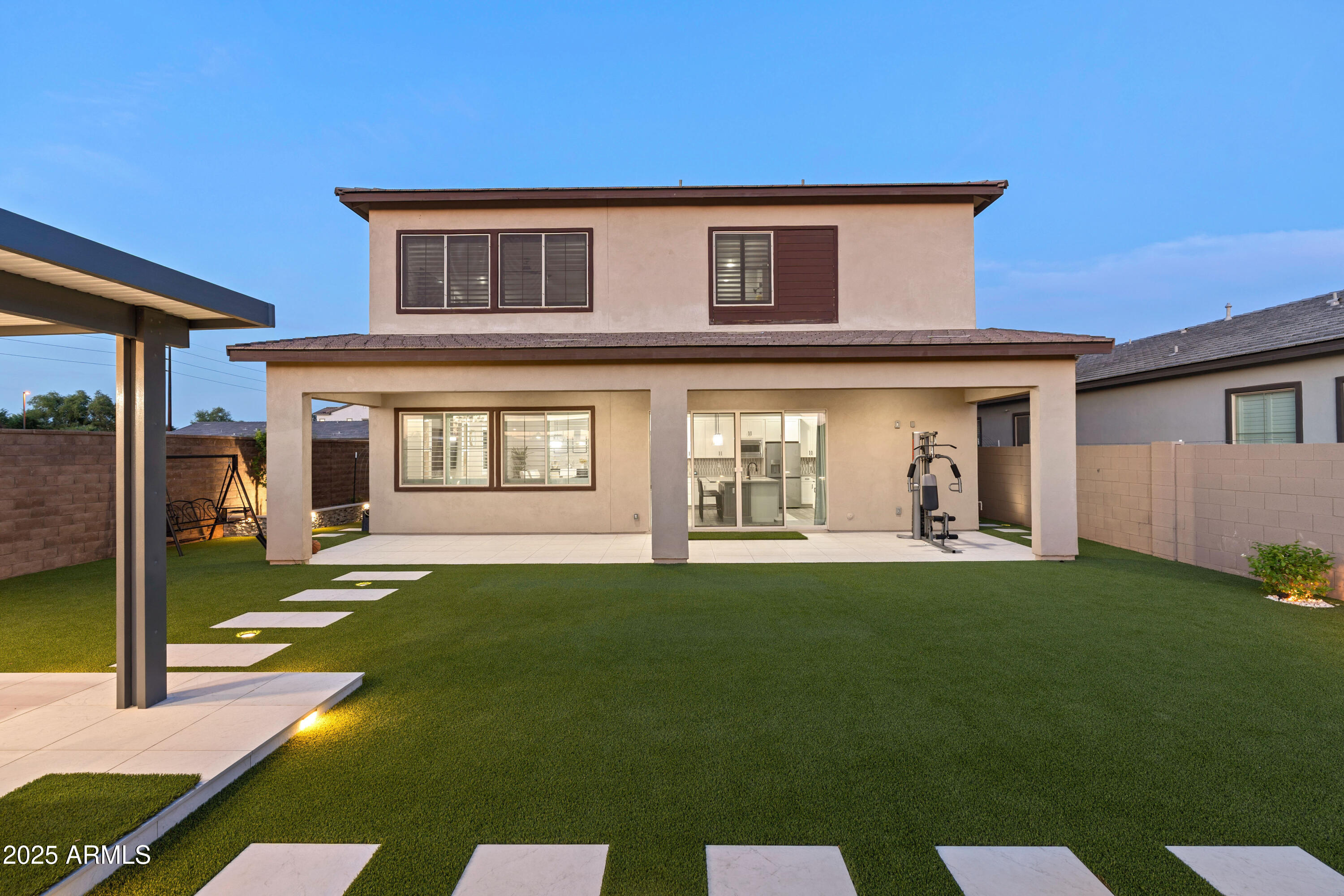 5232 South Cobblestone Street Gilbert, AZ 85298 - Photo 67 of 71 a front view of a house with a yard