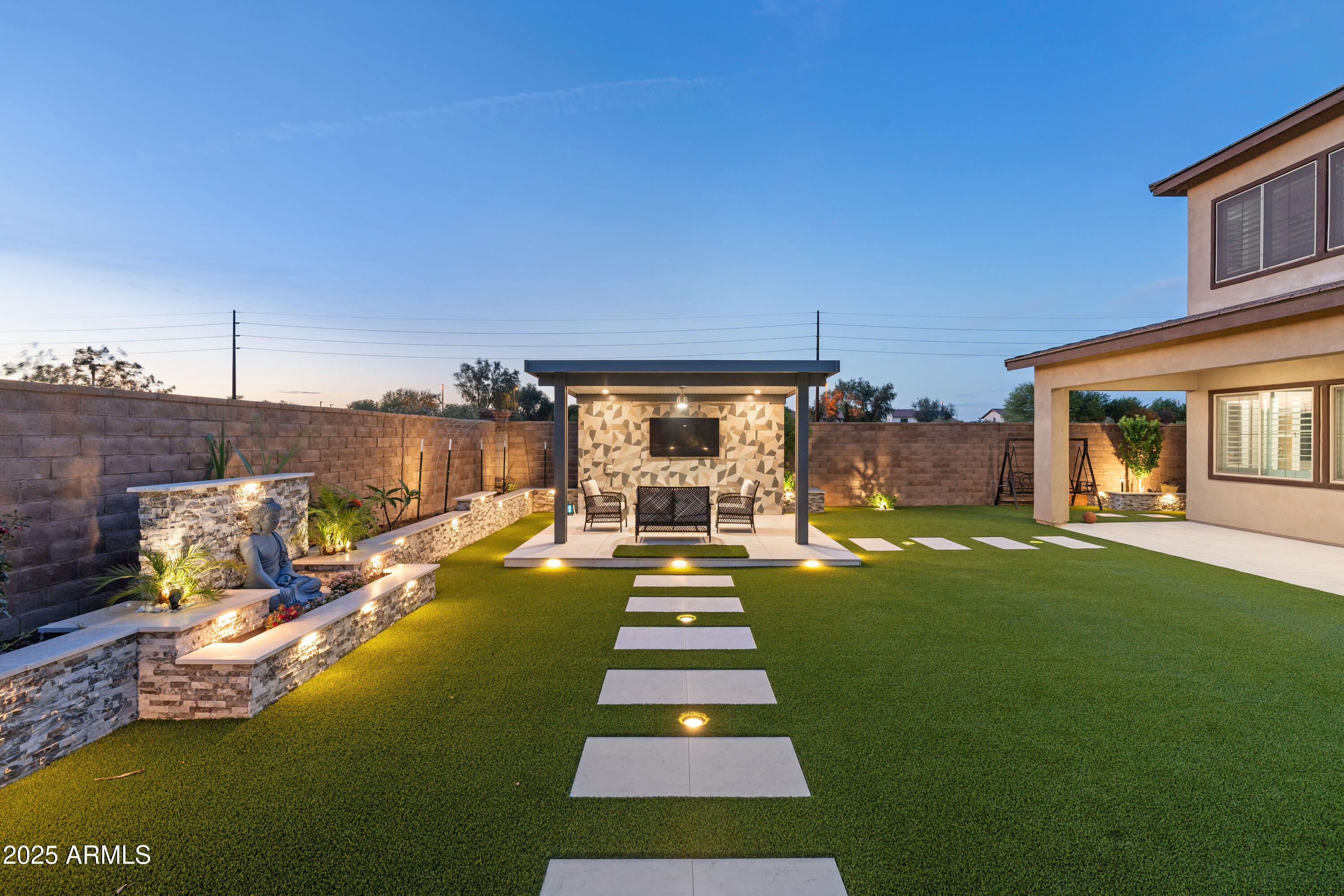 5232 South Cobblestone Street Gilbert, AZ 85298 - Photo 68 of 71 a view of swimming pool in the backyard of house along with seating space