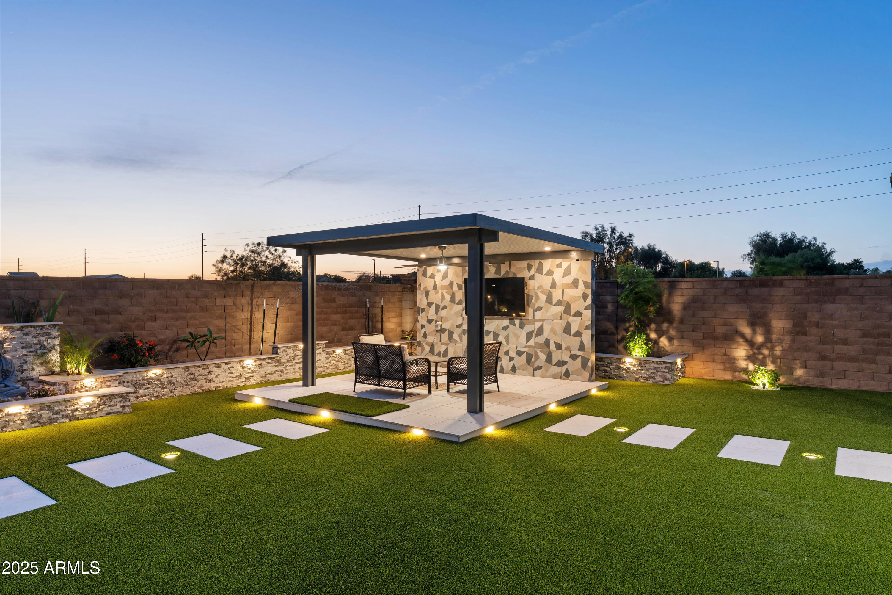 5232 South Cobblestone Street Gilbert, AZ 85298 - Photo 69 of 71 a view of a swimming pool with a yard