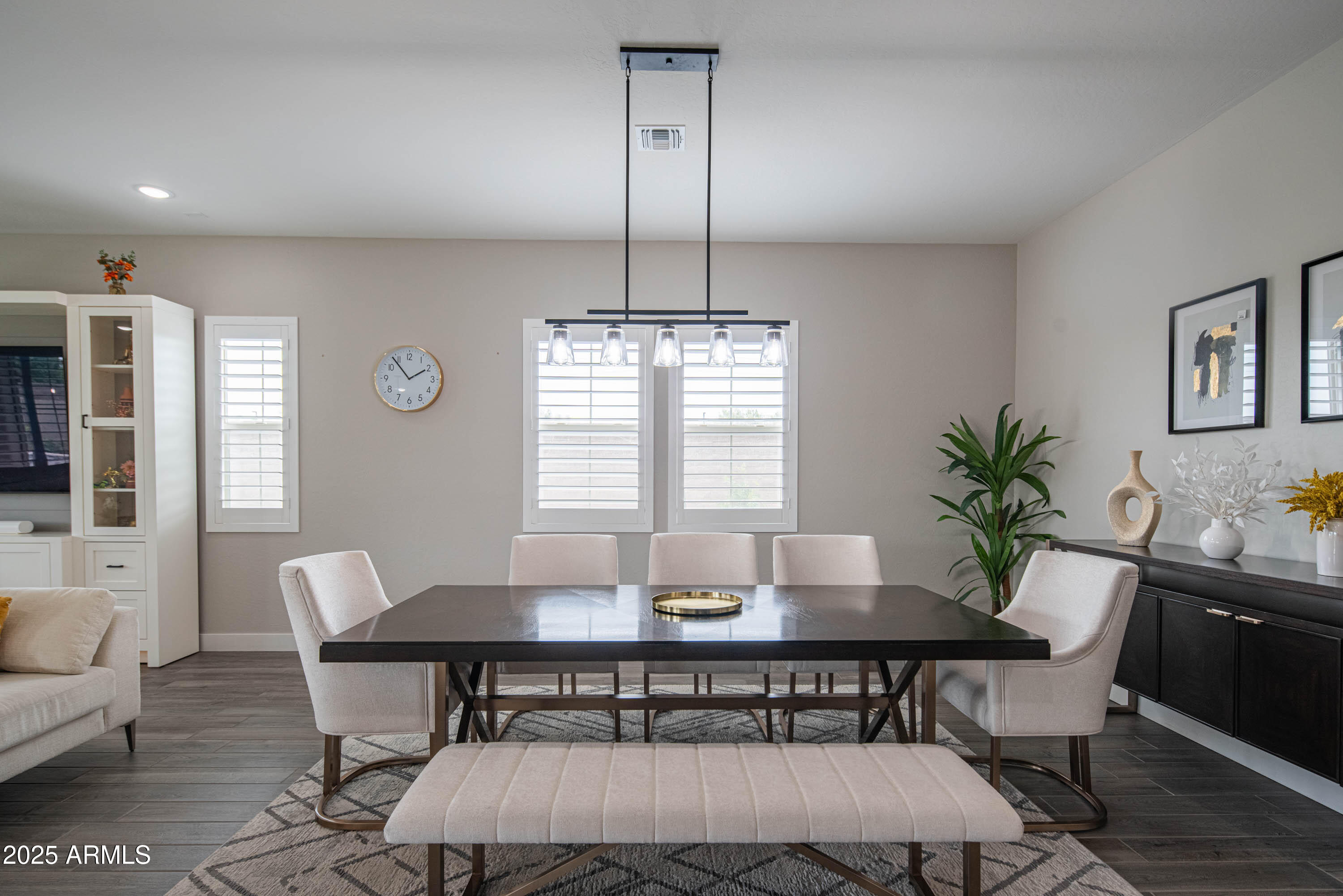 5232 South Cobblestone Street Gilbert, AZ 85298 - Photo 7 of 71 a view of a dining room with furniture window and wooden floor