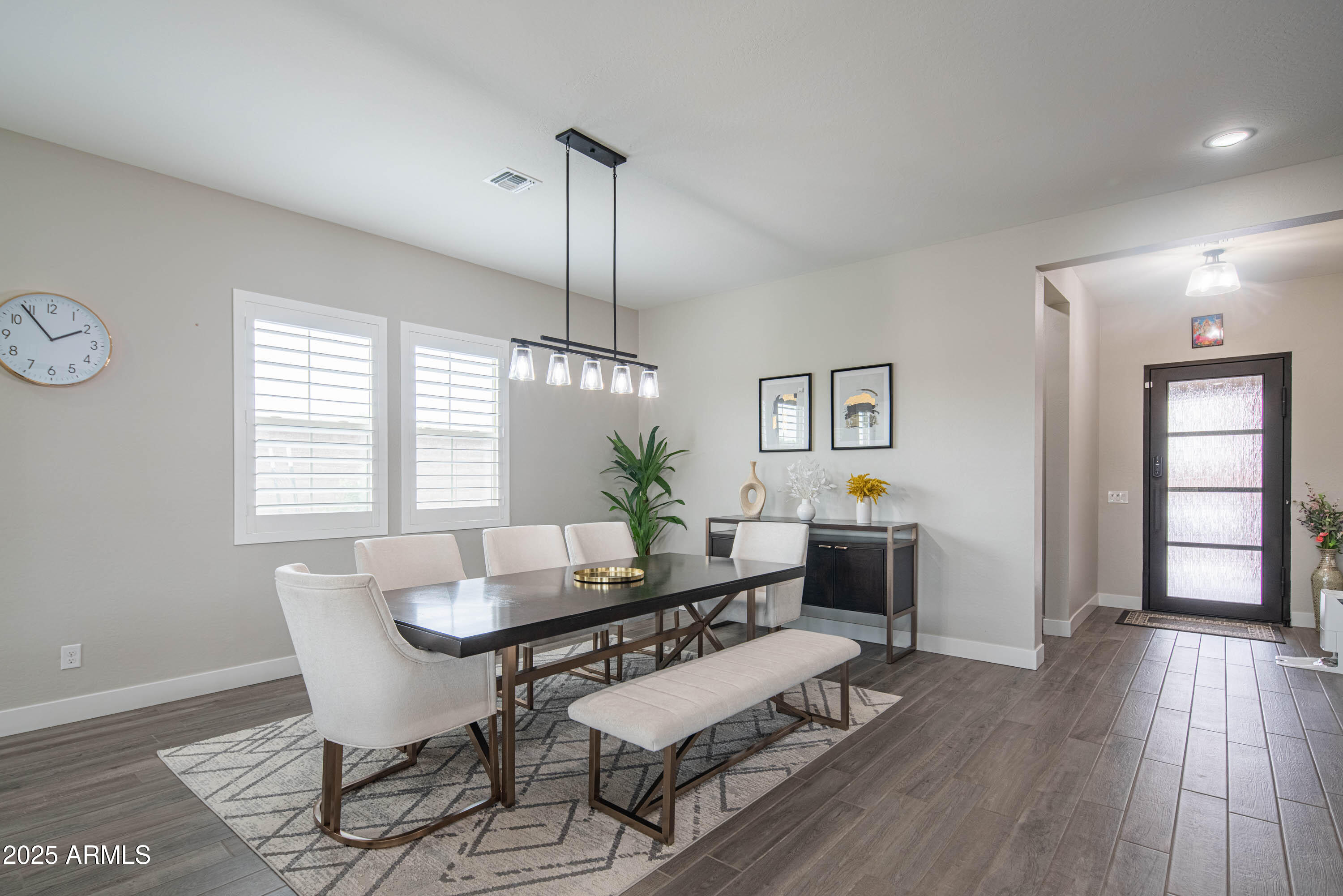 5232 South Cobblestone Street Gilbert, AZ 85298 - Photo 8 of 71 a view of a dining room with furniture window and wooden floor