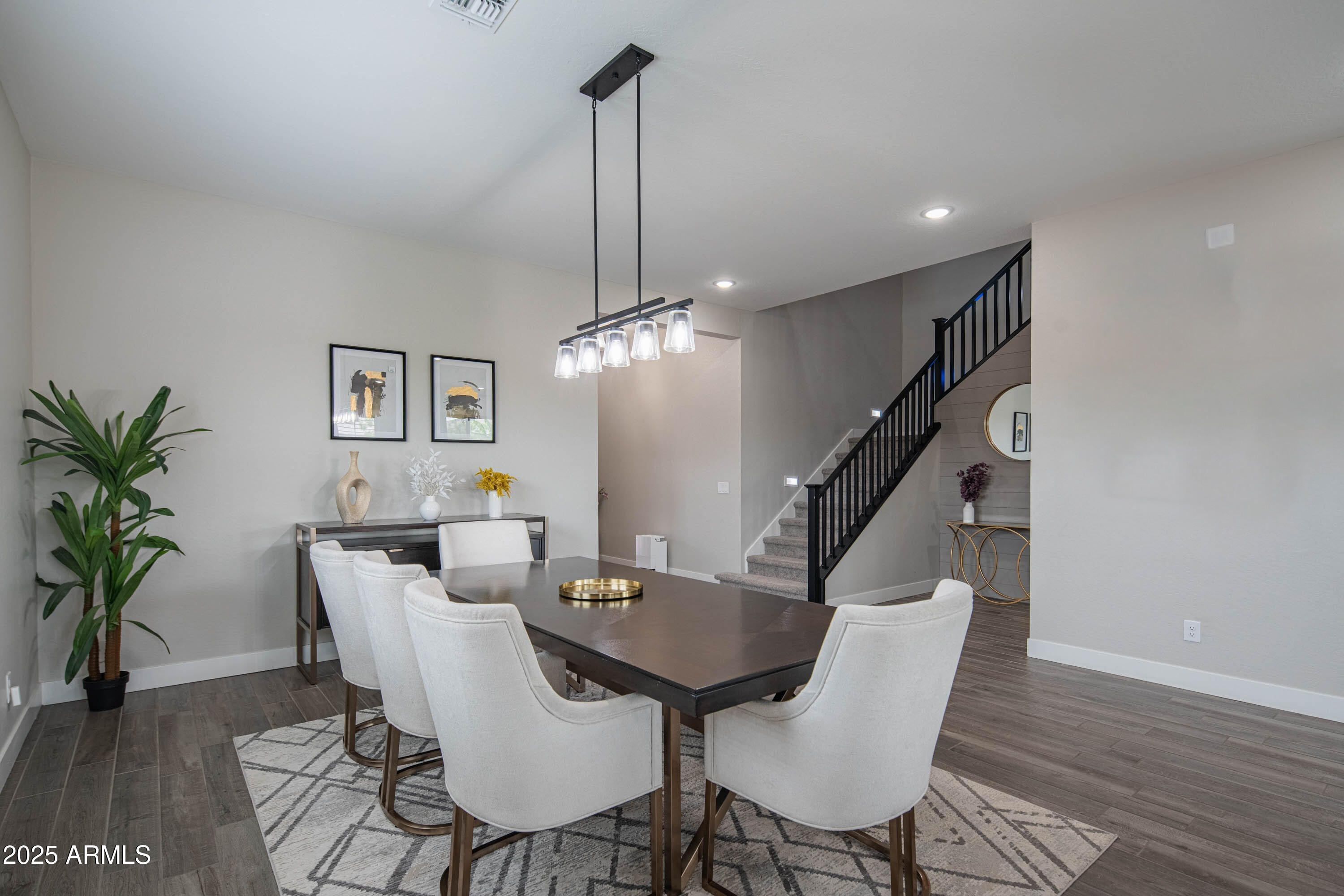 5232 South Cobblestone Street Gilbert, AZ 85298 - Photo 10 of 71 a view of a dining room with furniture wooden floor and chandelier
