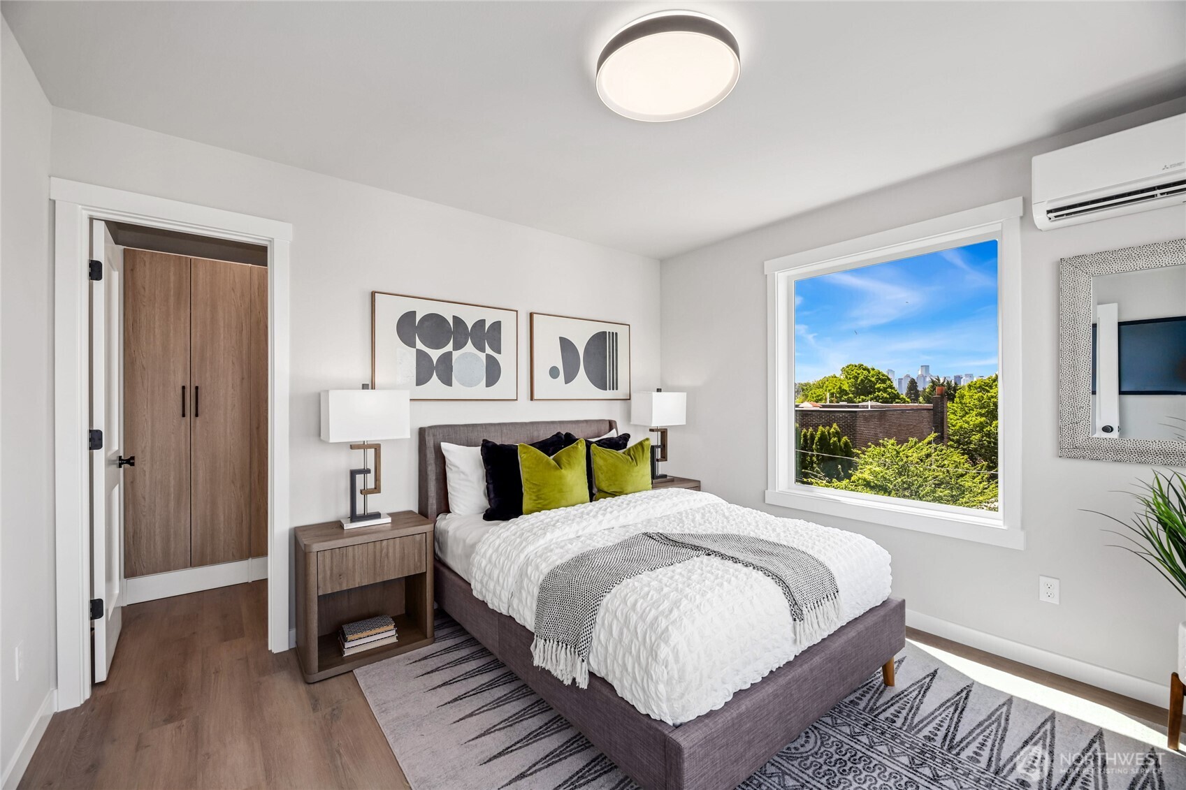 2817 Franklin Avenue East, Unit B Seattle, WA 98102 - Photo 11 of 24 a bedroom with a bed and a painting on the wall