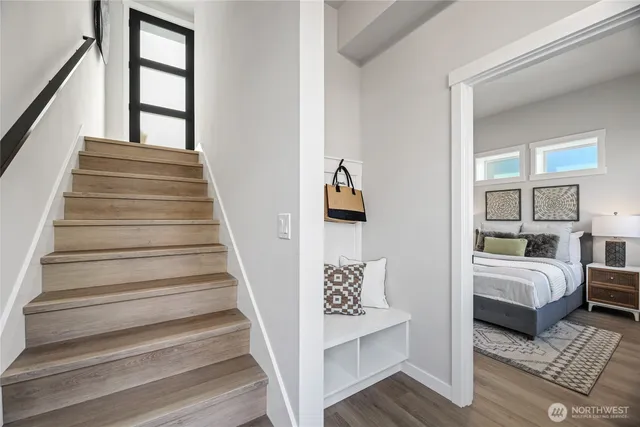 a view of staircase with white walls and windows