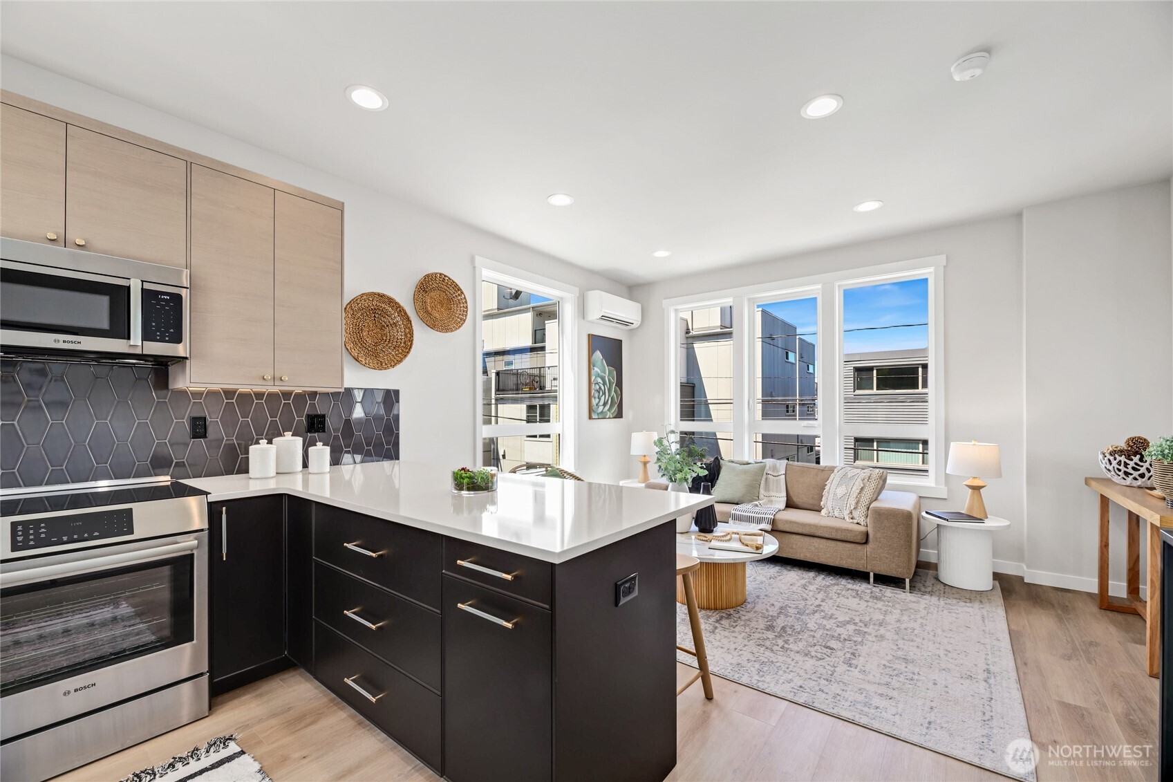 2817 Franklin Avenue East, Unit B Seattle, WA 98102 - Photo 7 of 24 a kitchen with a sink stove and cabinets