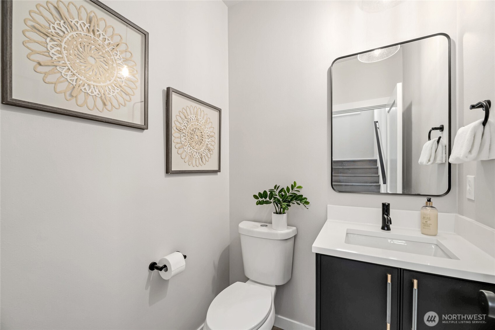 2817 Franklin Avenue East, Unit B Seattle, WA 98102 - Photo 8 of 24 a bathroom with a toilet sink and mirror